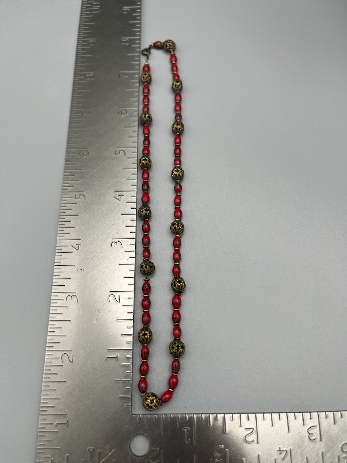 Vintage Red Glass Bead Necklace with Ornate Brass Filigree Accents