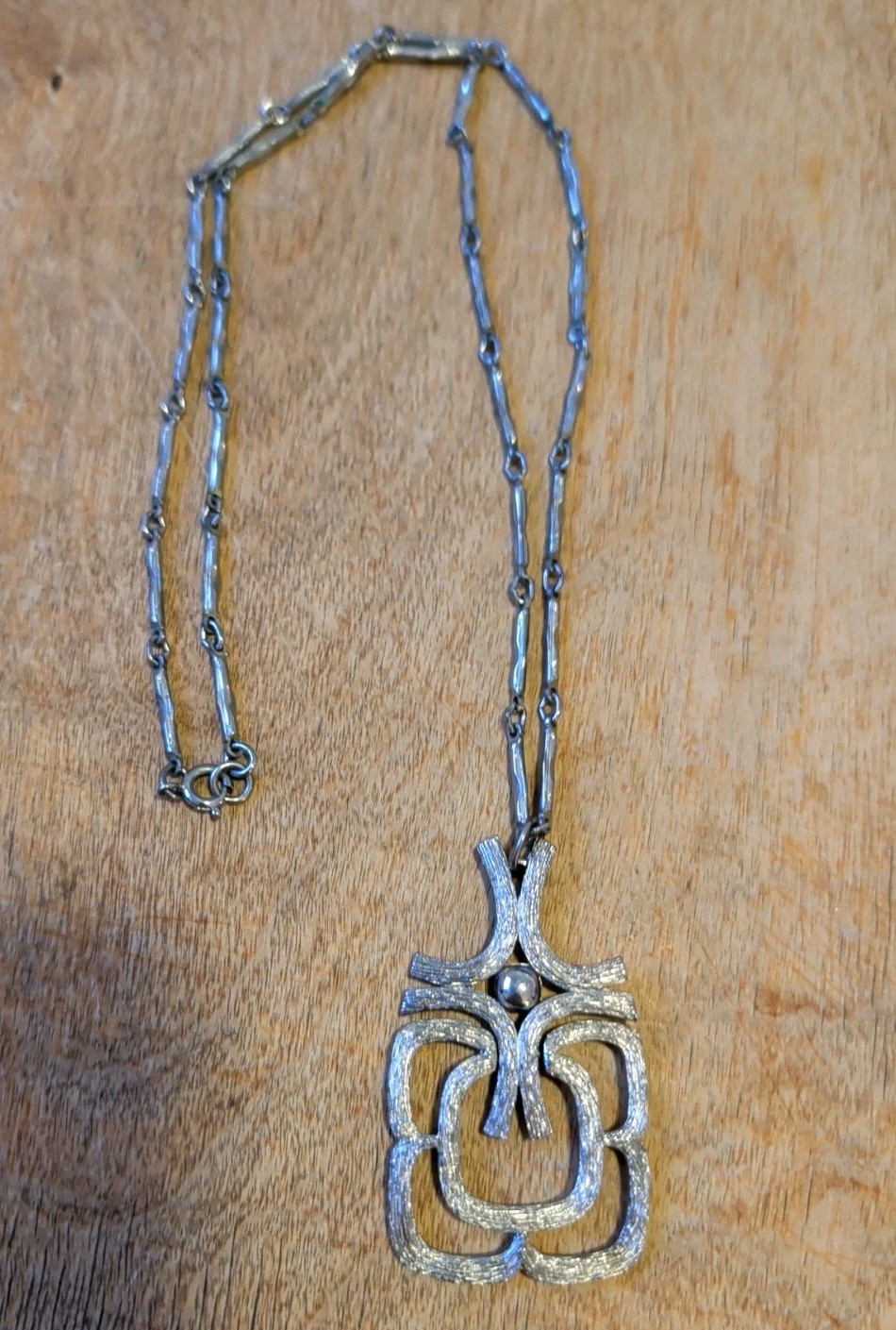 Avon Articulated Pendant on Chain-link chain. 24”