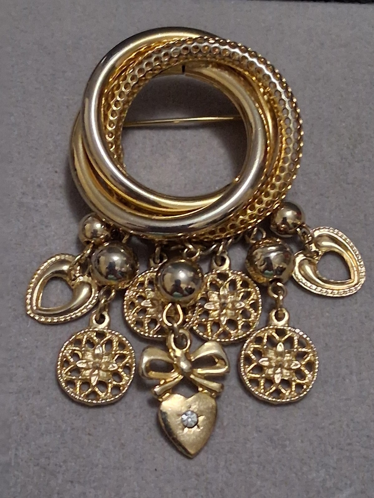 Interlocking circle charm brooch, gold-toned dangle drop charms