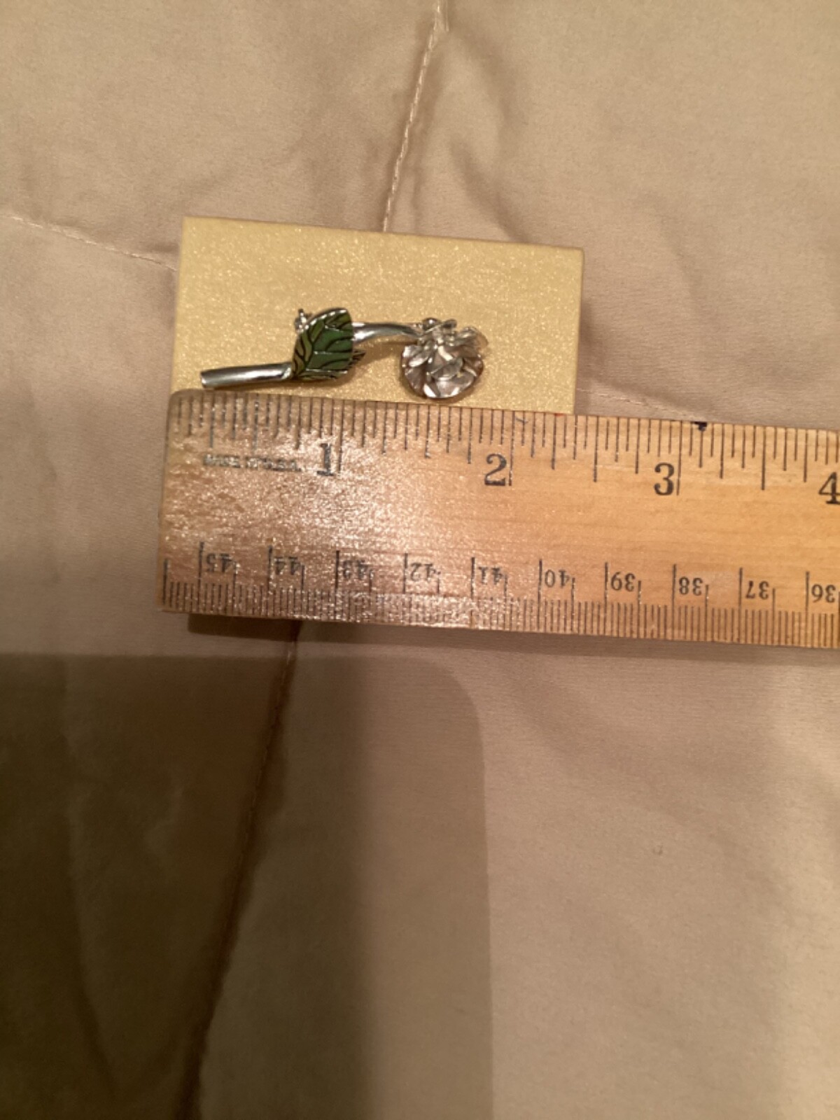 Avon vintage pin clear looking center with green leaves small almost 2” detailed