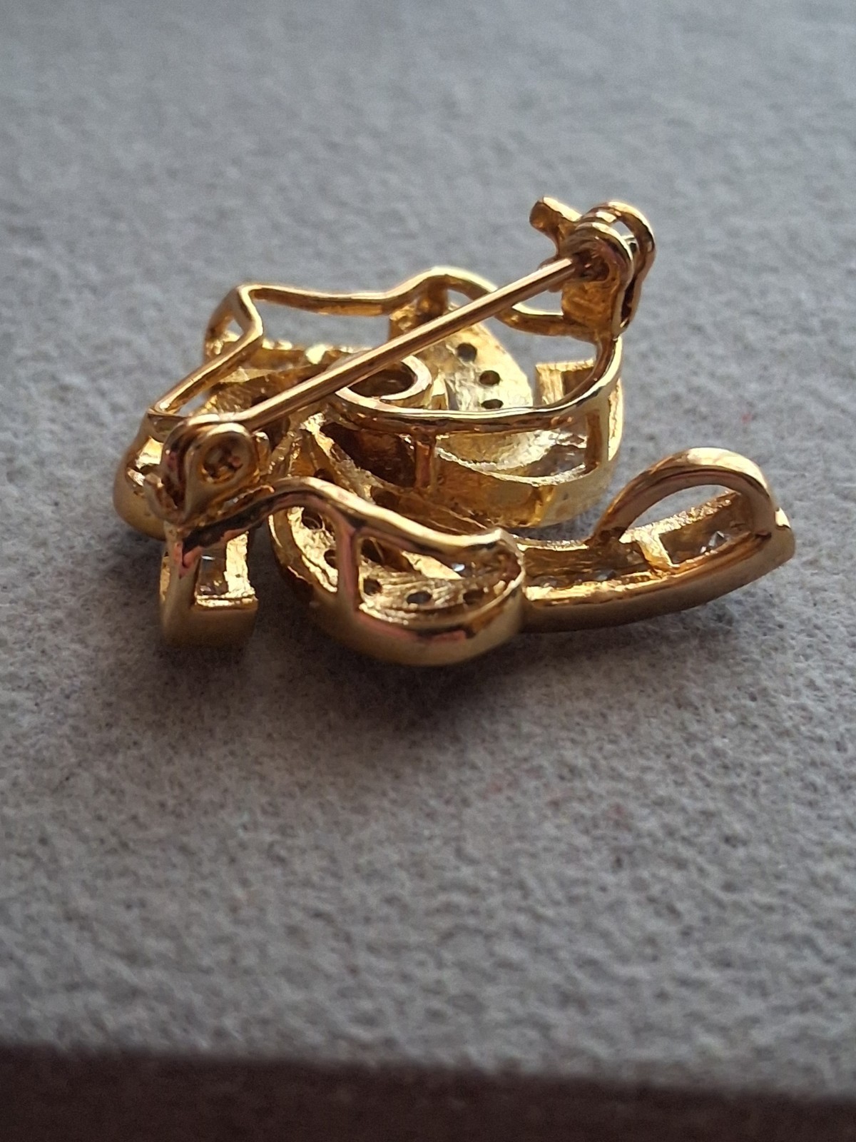 Pinwheel cubic zirconia embellished gold plated convertible brooch/pendant