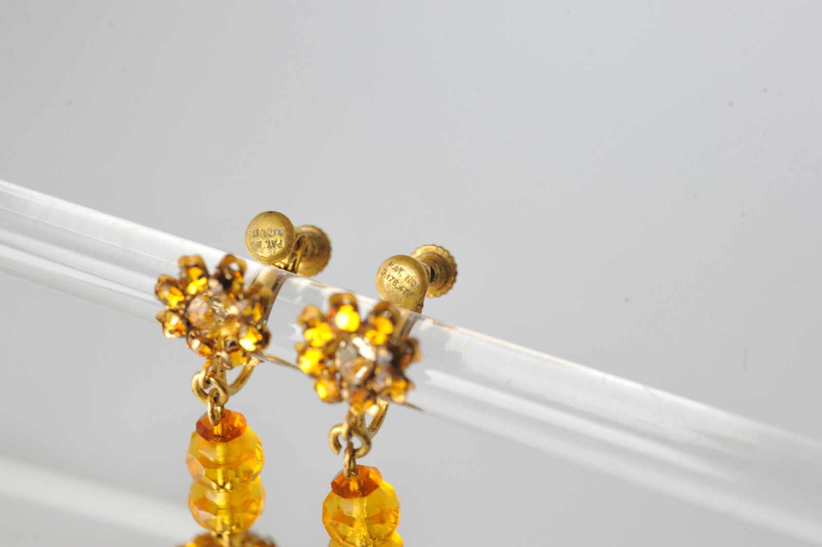 Vtg signed Miriam Haskell rhinestone Gold Tone drop clip earrings amber color