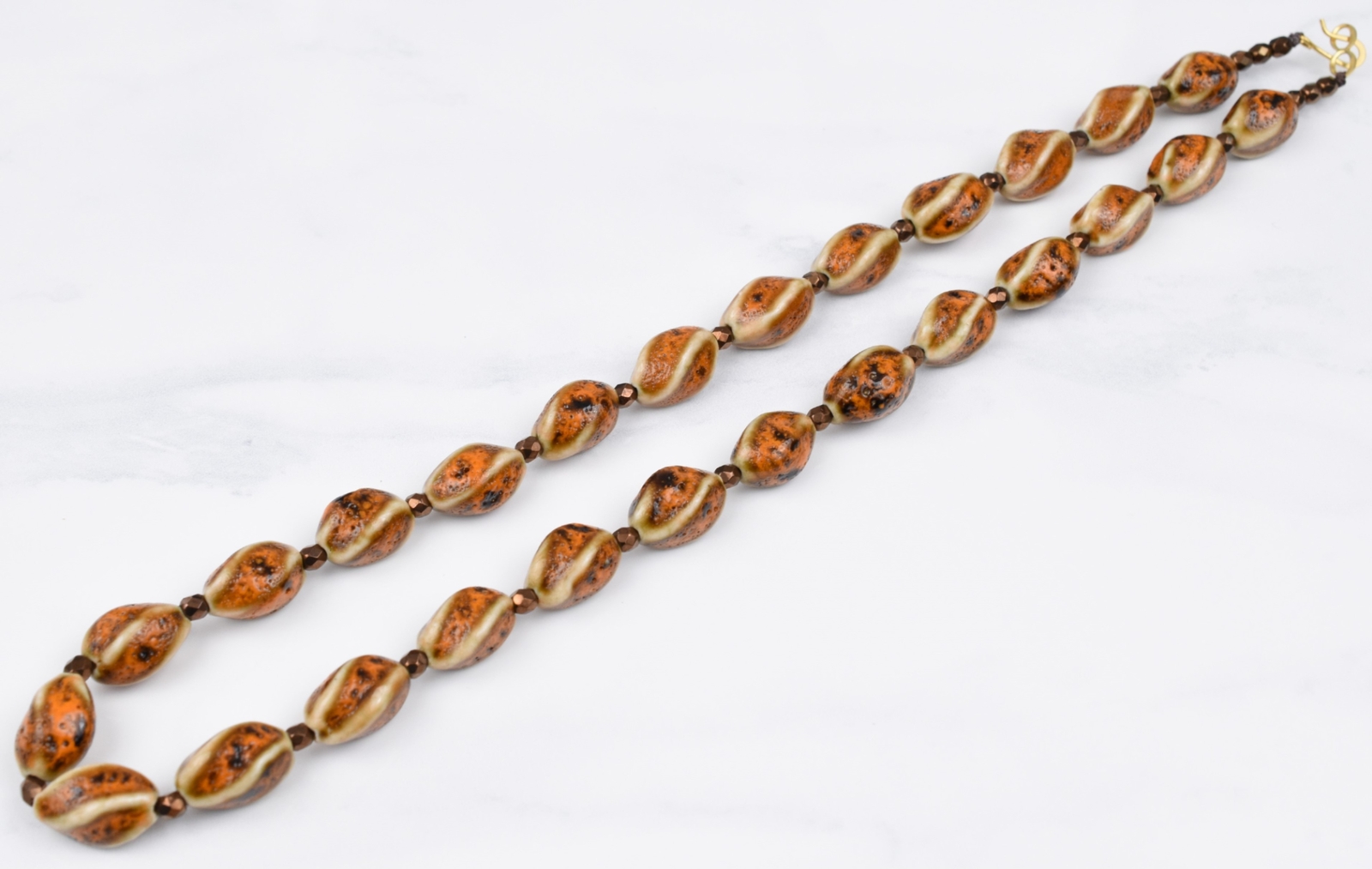 Gold Plated 21″ Cream Brown Orange Twist Ceramic Necklace w/ Bronze Spacers