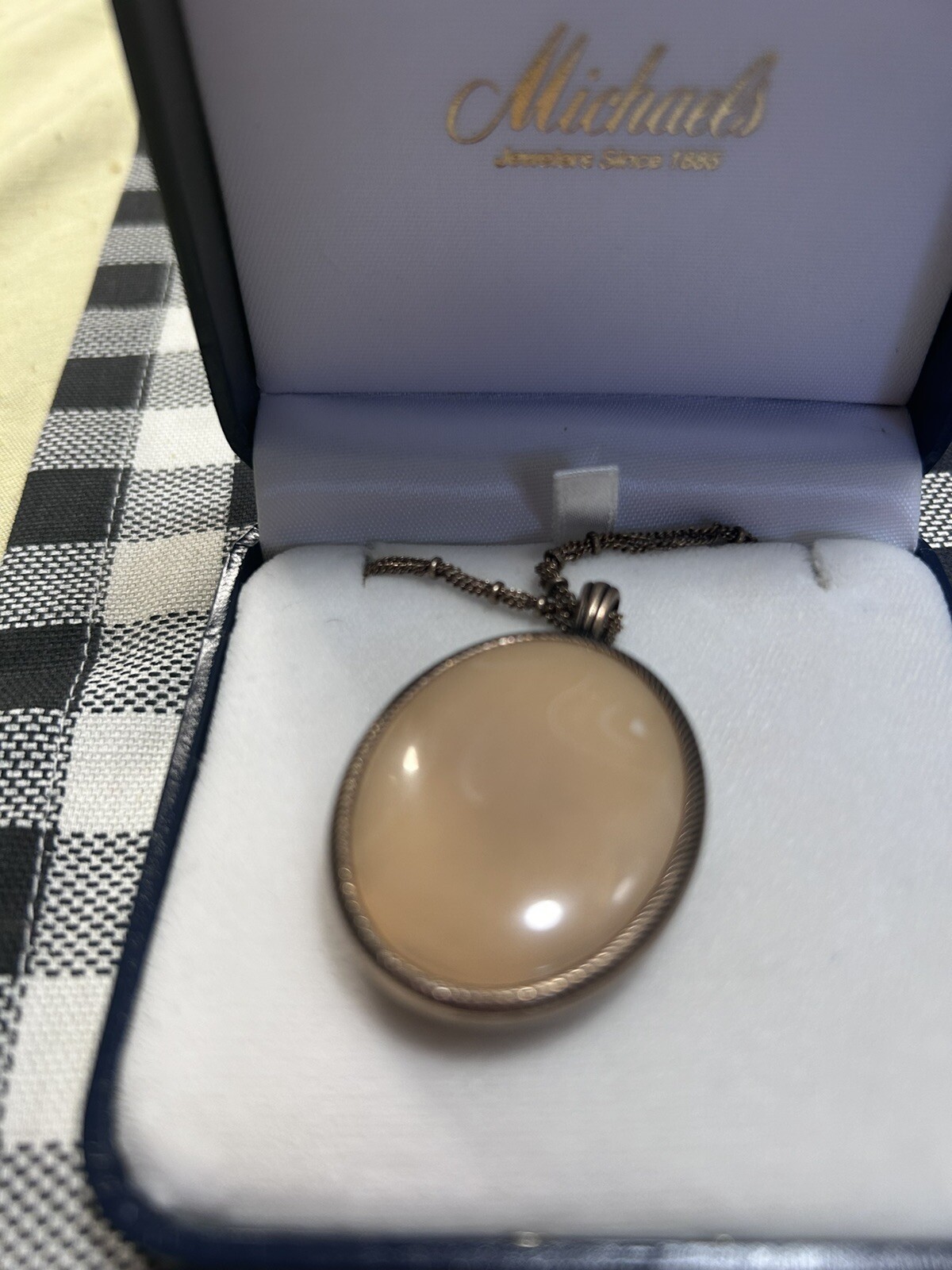 Mother of pearl necklace on one side not sure on the other side what it is