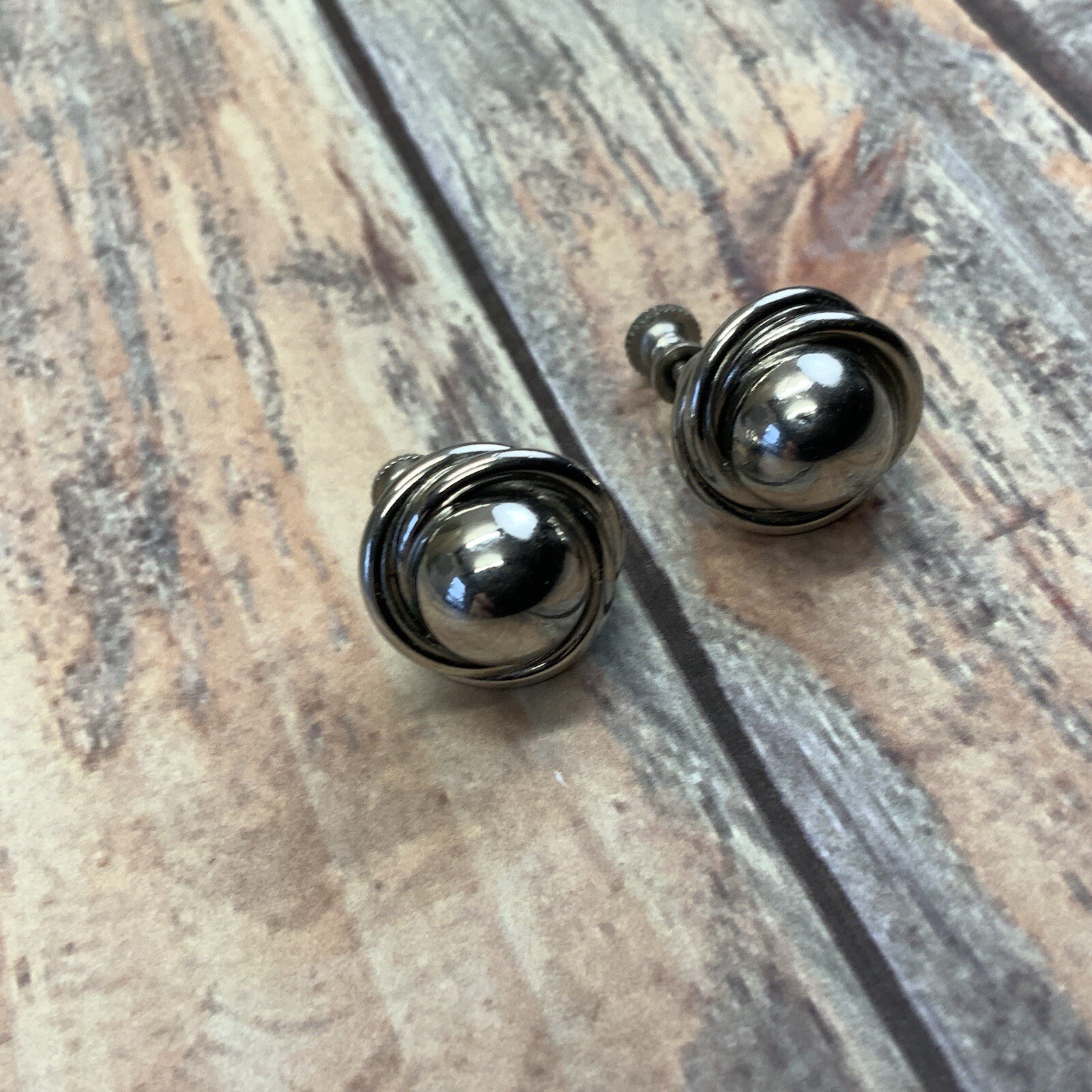 Vintage silver tone screw back knot earrings with dome