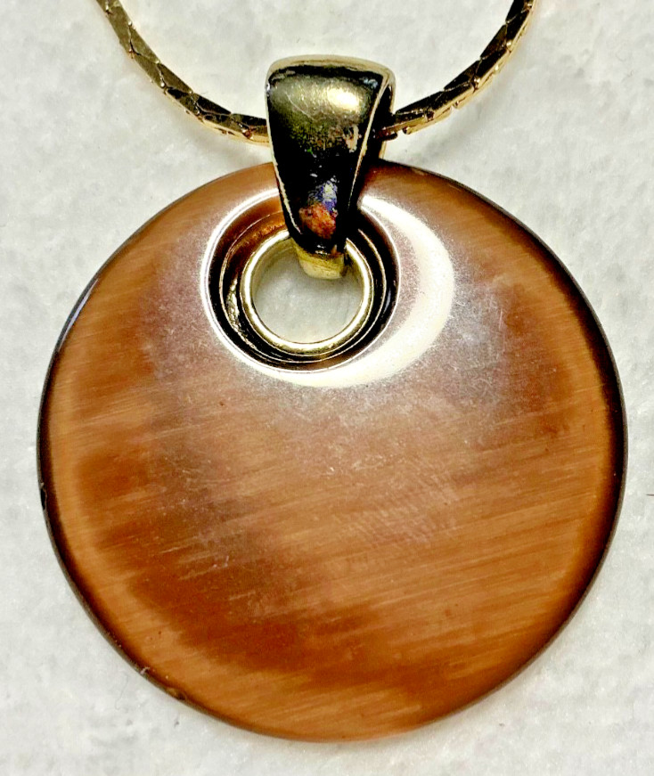 Vintage Brown Acrylic Disc Pendant with a brown rhinestone and Gold Tone Chain
