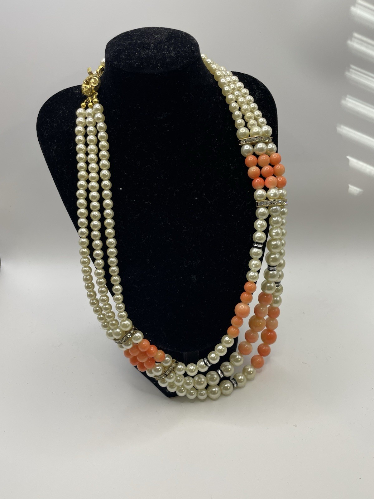 Vintage ivory and coral triple strand pearl necklace with gold tone clasp 20”