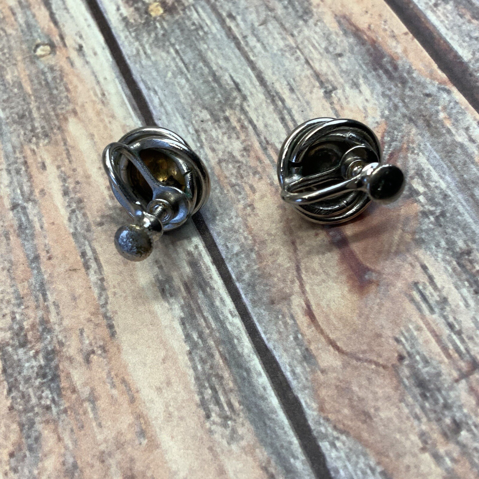 Vintage silver tone screw back knot earrings with dome