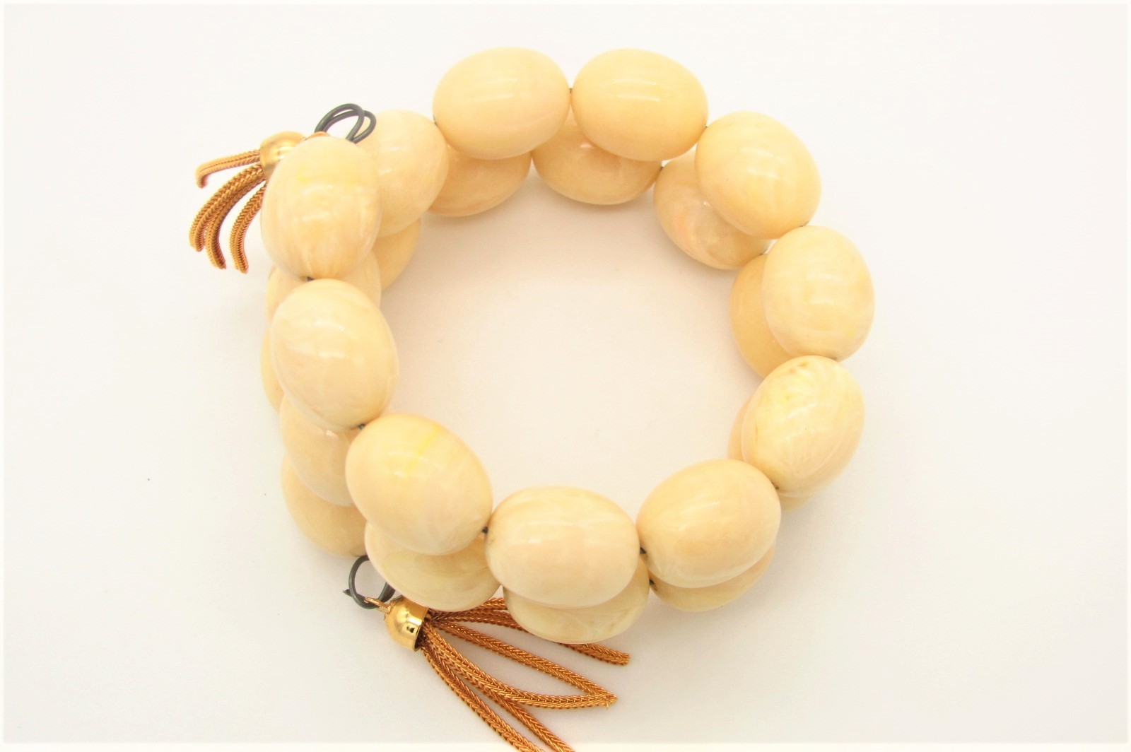 Vtg Coil Bracelet w/Faux Ivory Galalith Beads and Gold Tone Tassel Ends