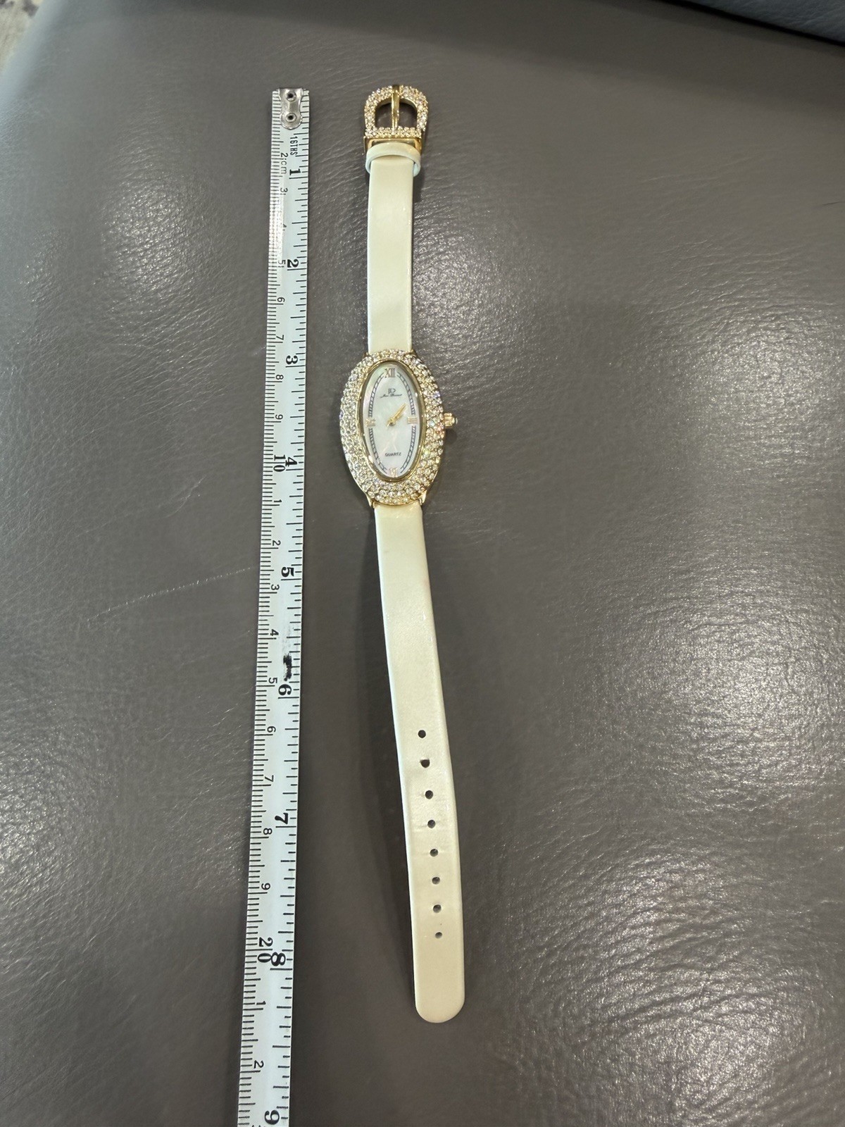Vintage Jean Dousset Leather, Rhinestone Watch With Beige oval face.