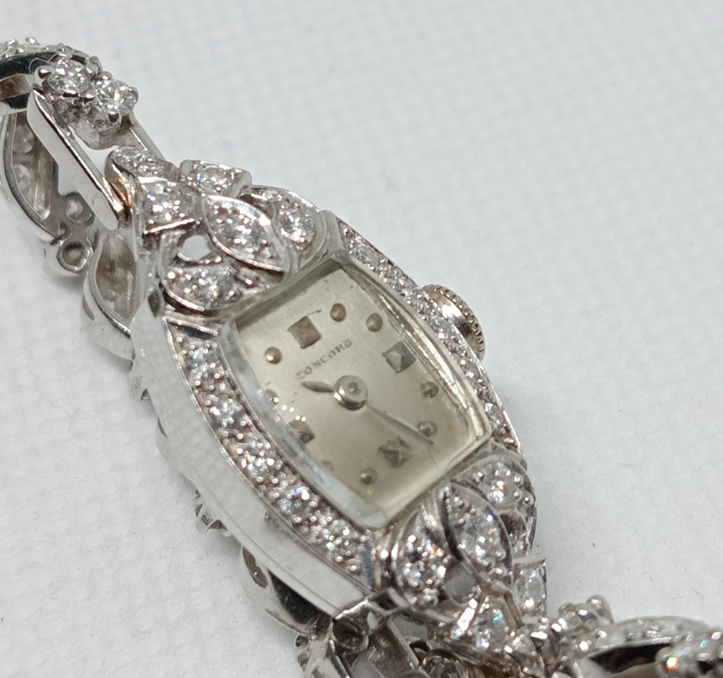 STAMPED IRID PLATINUM MANUAL CONCORD LADIES DIAMOND WRIST WATCH