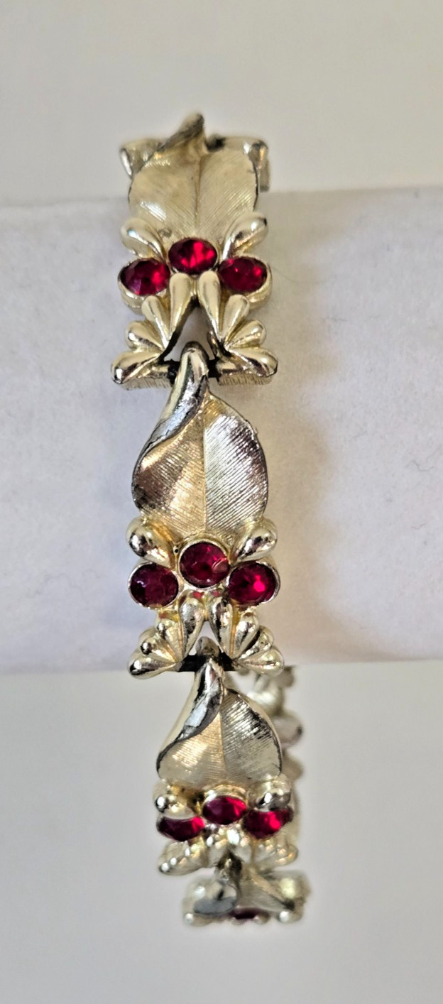 Vintage STAR Bracelet. Signed. Goldtone Setting with Red Rhinestone Accents.