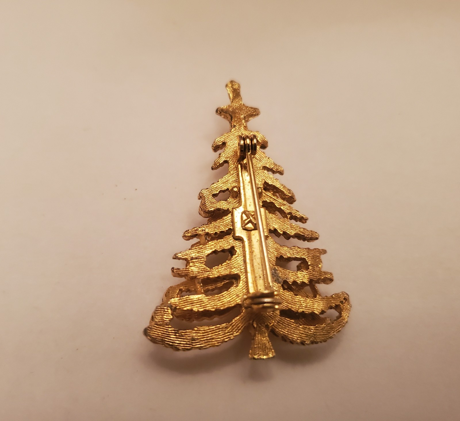 Vintage Holiday Tree Brooch Features Textured Gold-Tone Finish Decorated With…