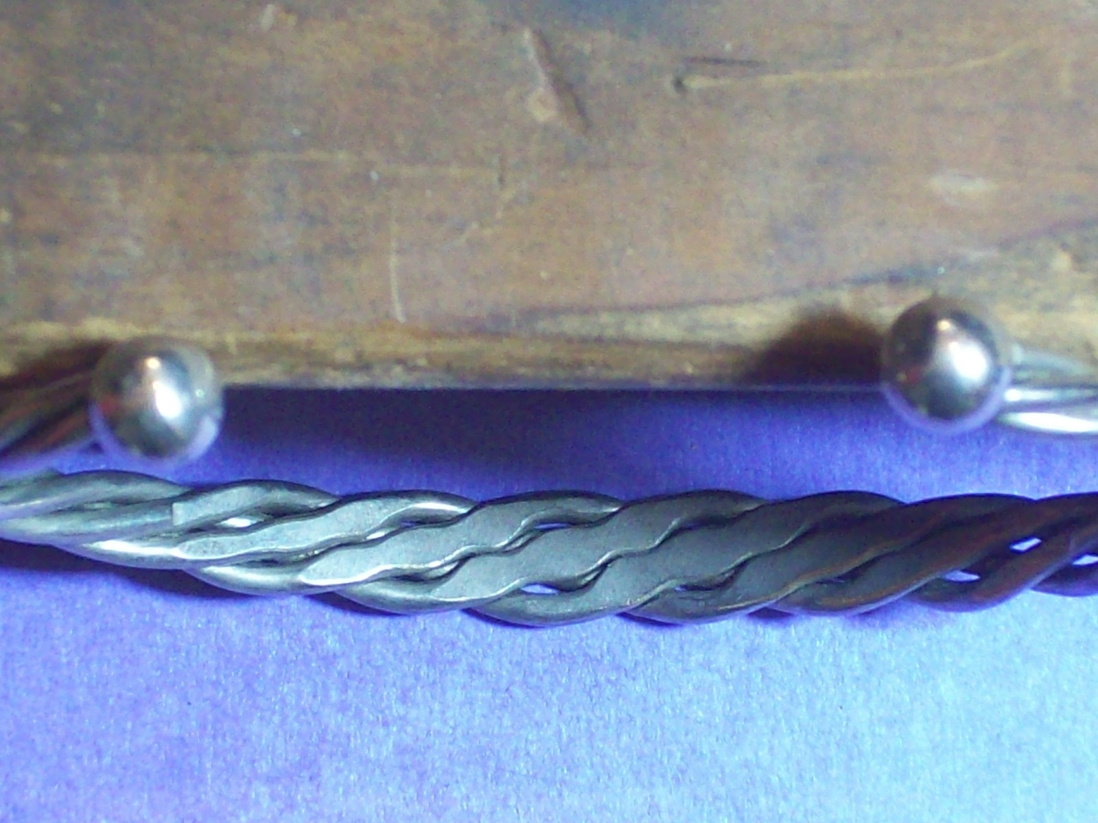 BRACELET ROPE STYLE SILVERY APPEARANCE 2 ¼” ACROSS INSIDE x 1 5/8” WIDE.